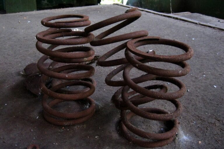 4 Symptoms Of A Bad Coil Spring (How To Fix And Replacement Cost)